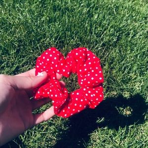 A red and white VSCO scrunchie